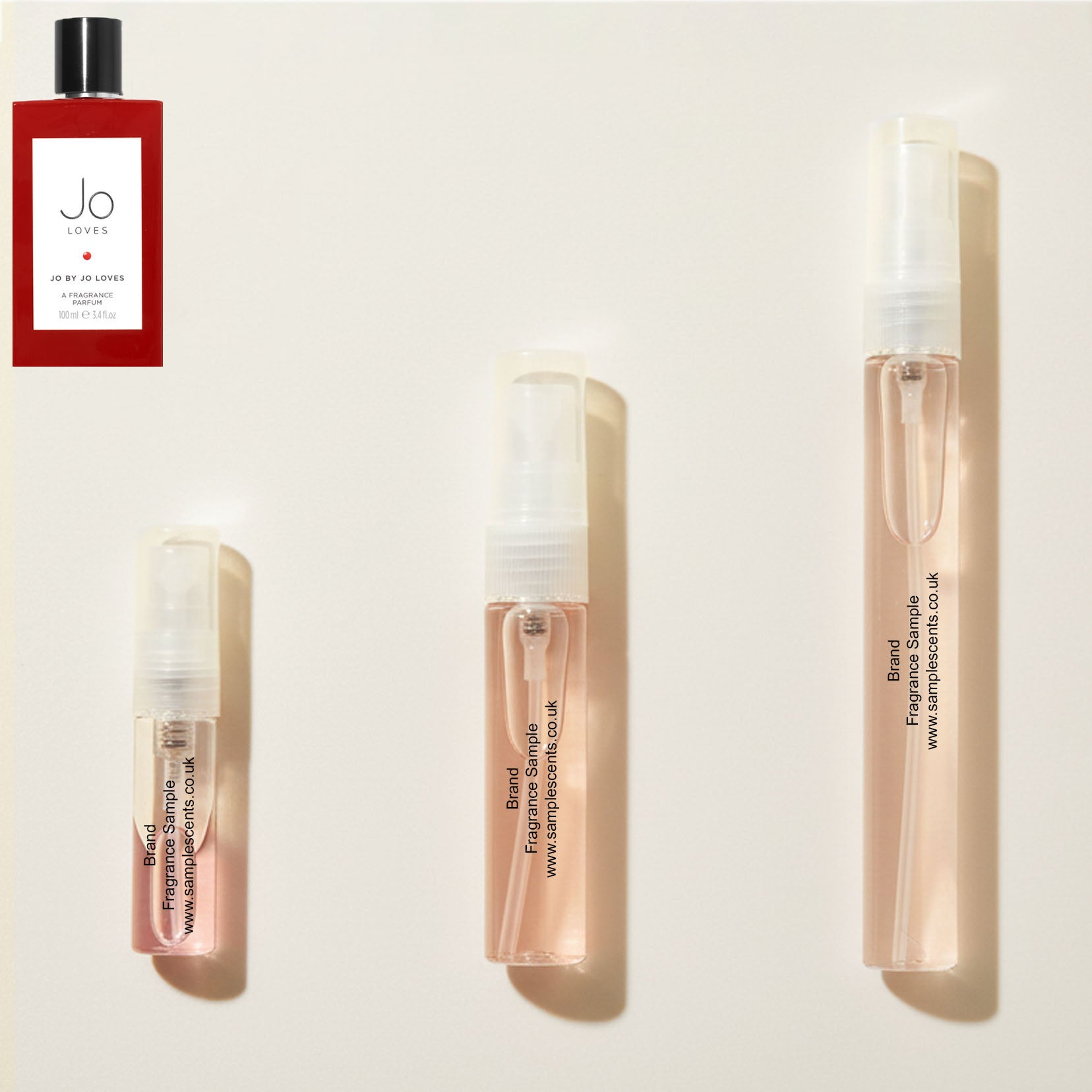 Perfume sample atomisers shown for size reference, hand-decanted from Jo Loves Jo By Jo Loves bottle.