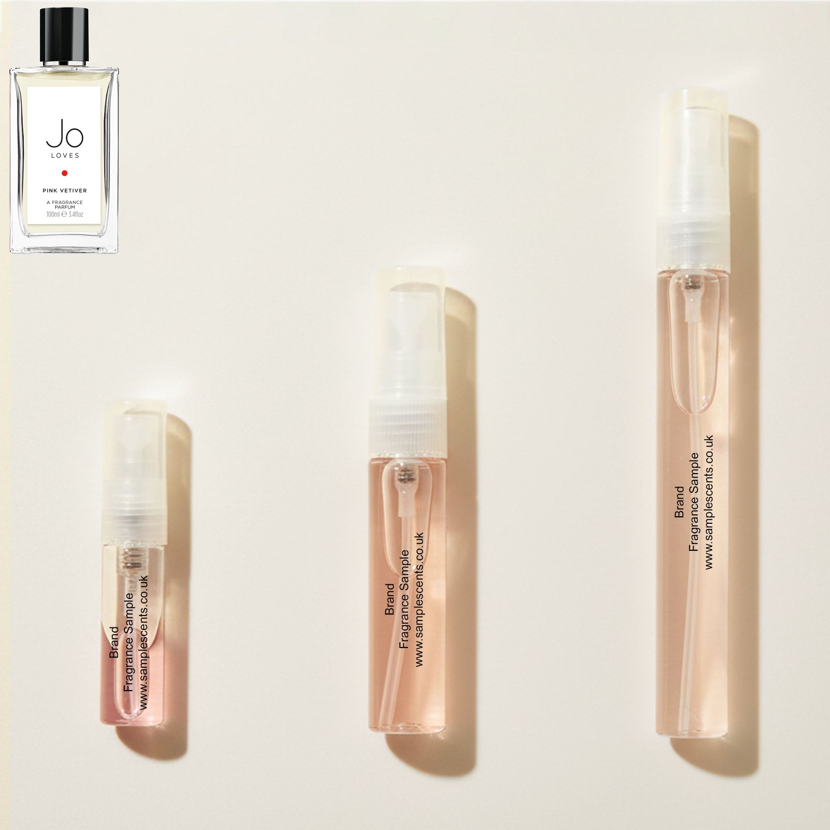 Perfume sample atomisers shown for size reference, hand-decanted from Jo Loves Pink Vetiver bottle.