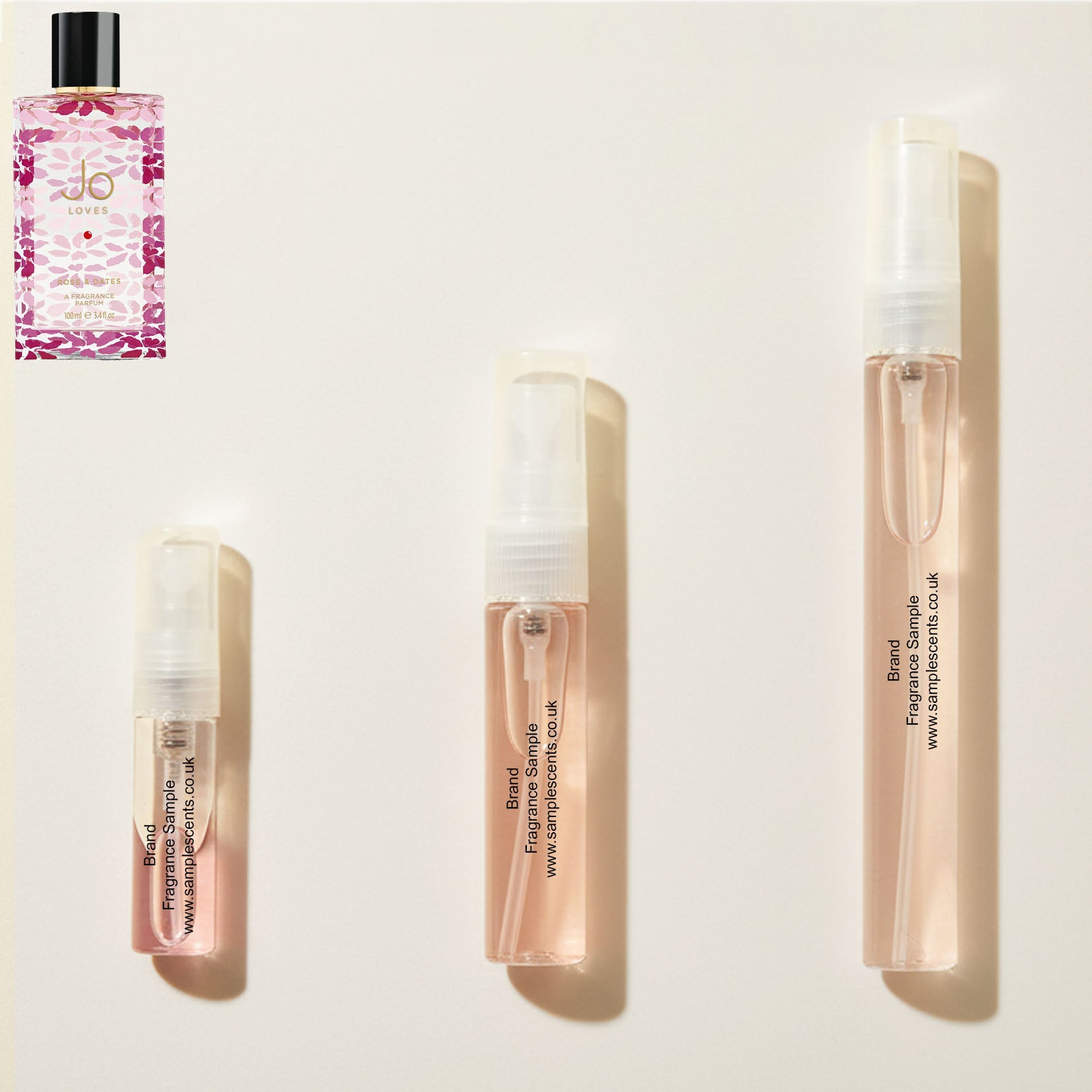 Perfume sample atomisers shown for size reference, hand-decanted from Jo Loves Rose & Dates bottle.
