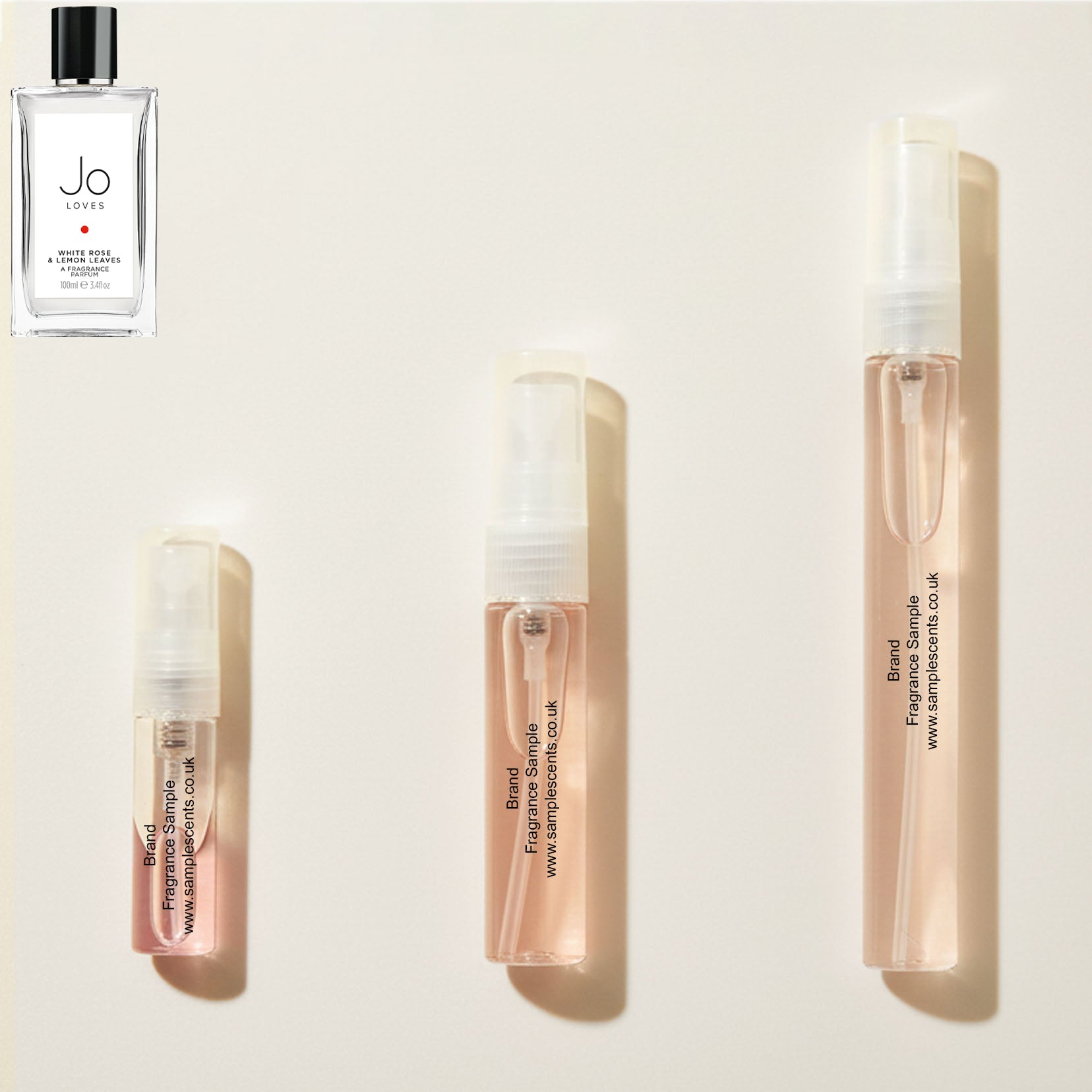 Perfume sample atomisers shown for size reference, hand-decanted from Jo Loves White Rose & Lemon Leaves bottle.