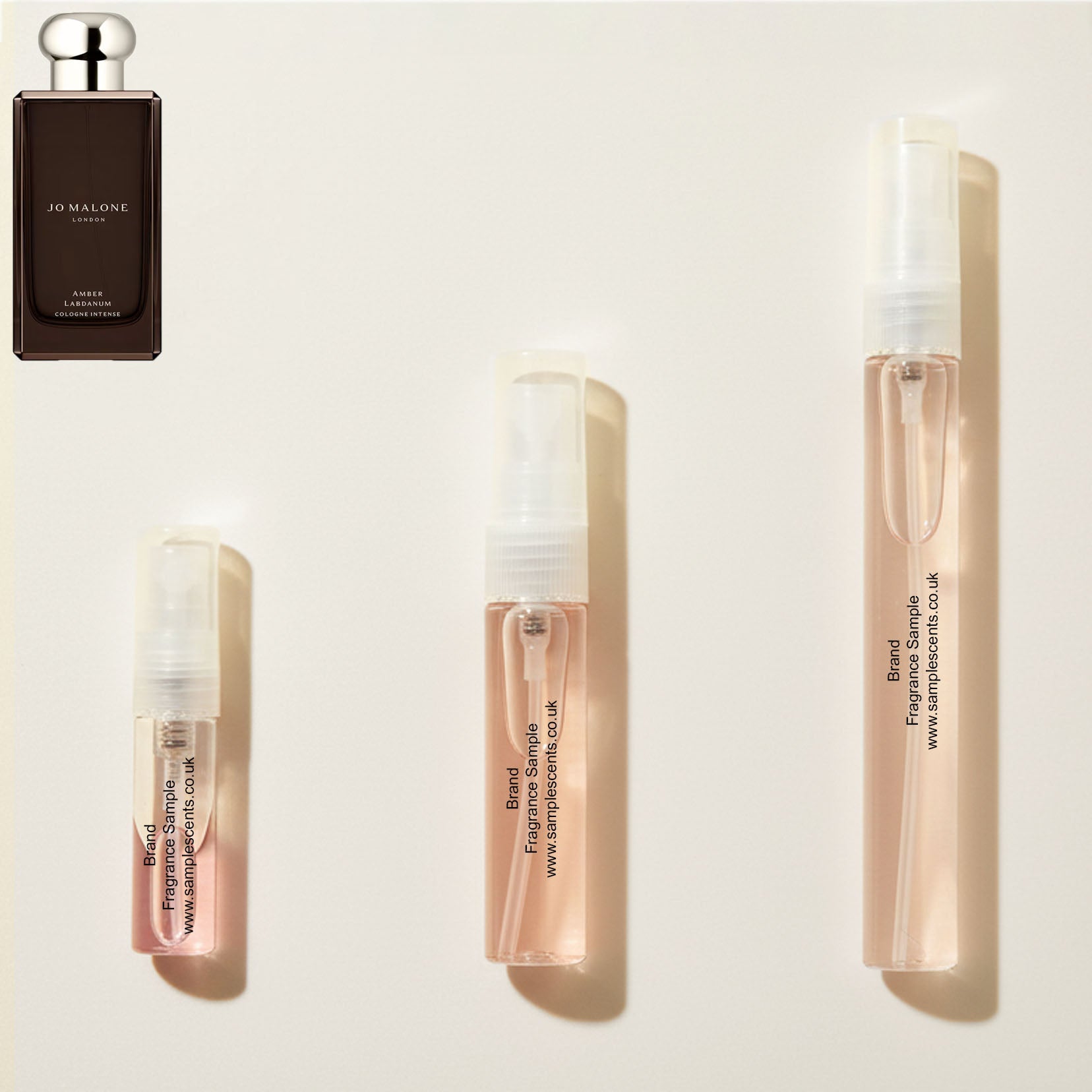 Perfume sample atomisers shown for size reference, hand-decanted from Jo Malone London Amber Labdanum bottle.
