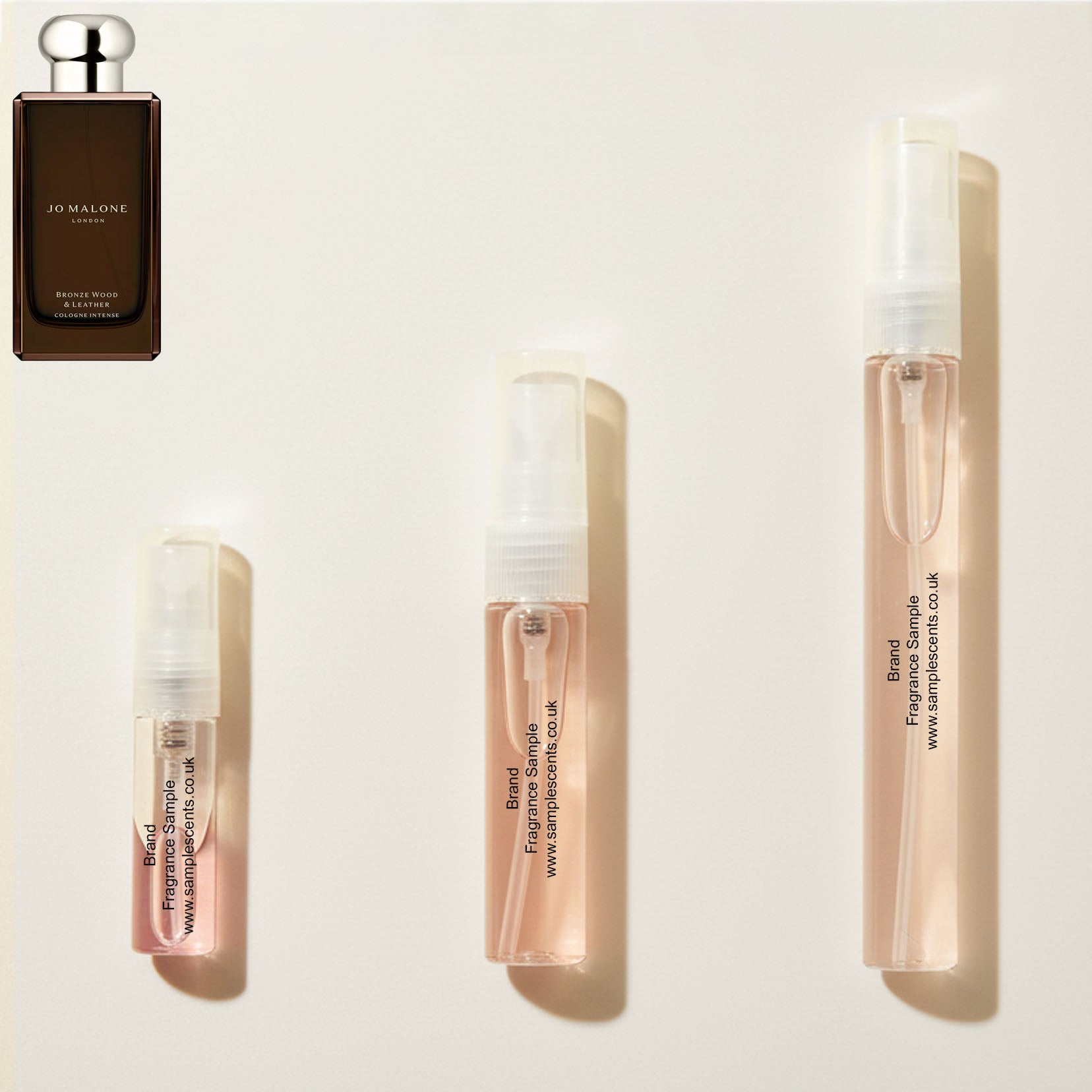 Perfume sample atomisers shown for size reference, hand-decanted from Jo Malone London Bronze Wood & Leather bottle. 