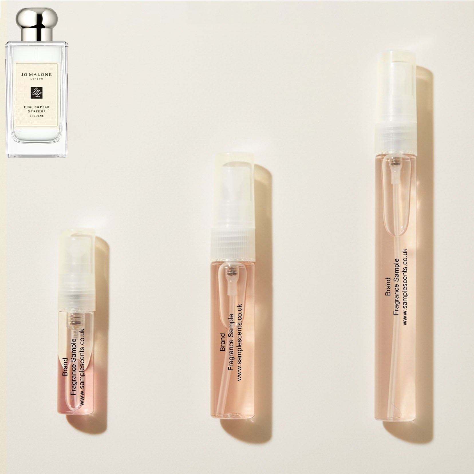 Perfume sample atomisers shown for size reference, hand-decanted from Jo Malone London English Pear & Freesia bottle.
