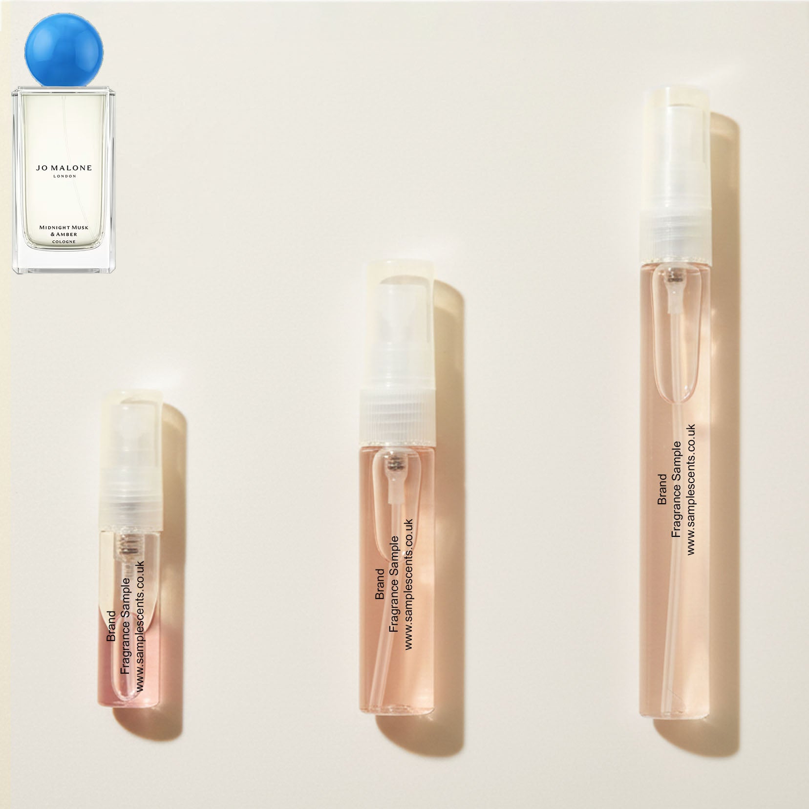 Perfume sample atomisers shown for size reference, hand-decanted from Jo Malone London Midnight Musk & Amber bottle.