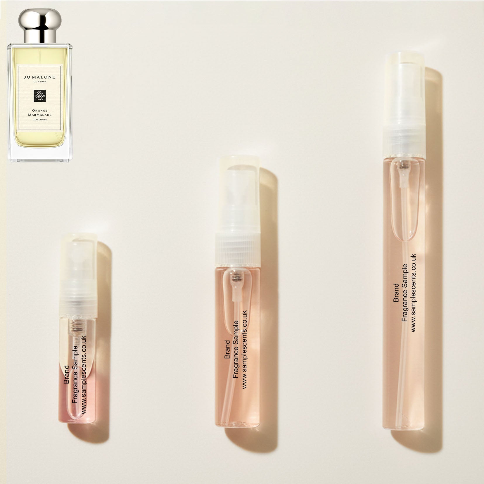 Perfume sample atomisers shown for size reference, hand-decanted from Jo Malone London Orange Marmalade bottle.