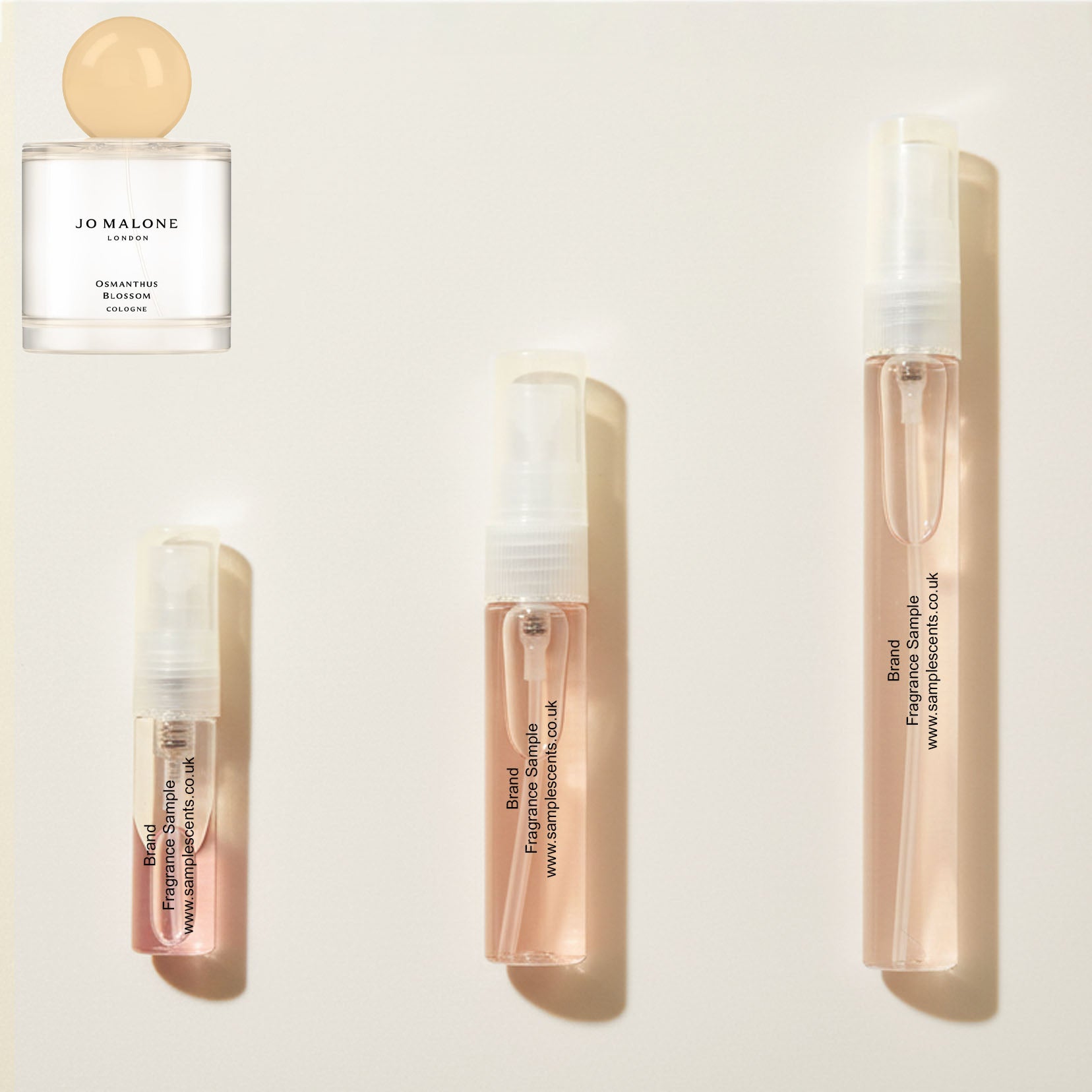 Perfume sample atomisers shown for size reference, hand-decanted from Jo Malone London Osmanthus Blossom bottle.