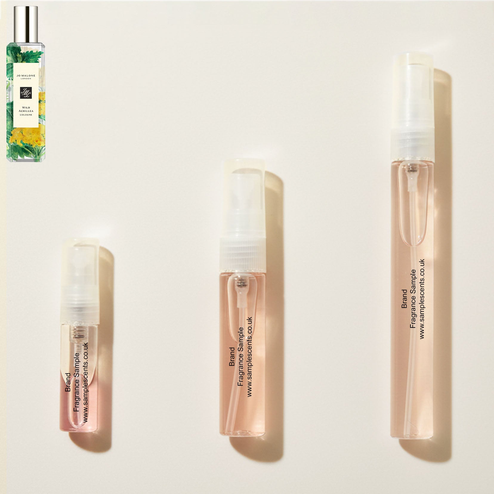 Perfume sample atomisers shown for size reference, hand-decanted from Jo Malone London Wild Achillea bottle.