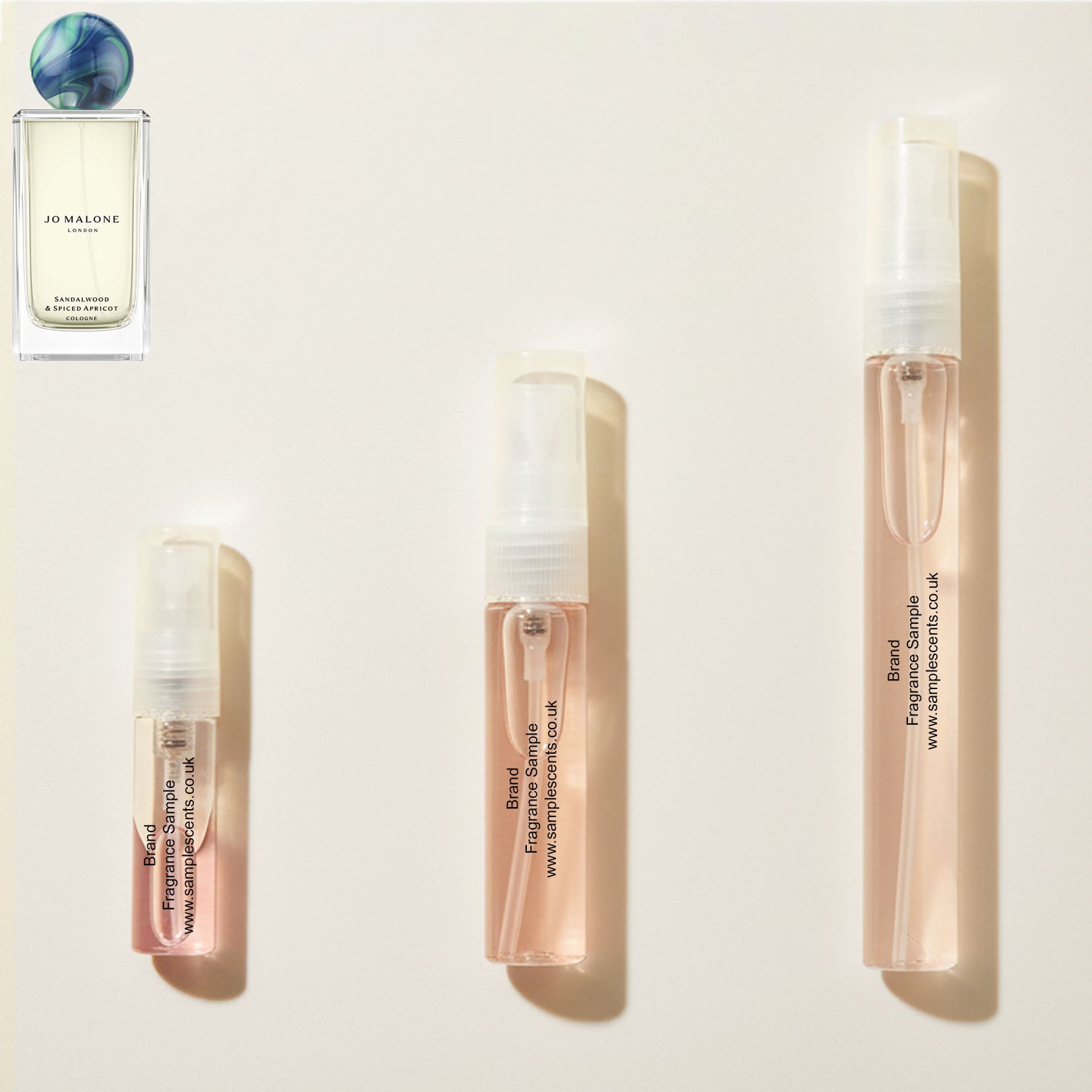 Perfume sample atomisers shown for size reference, hand-decanted from Jo Malone London Sandalwood & Spiced Apricot bottle.