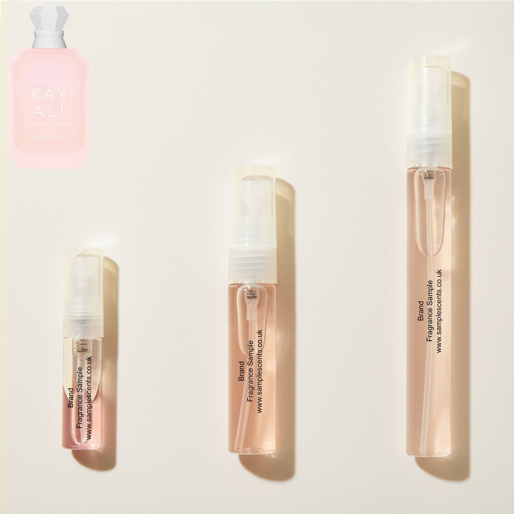 Perfume sample atomisers shown for size reference, hand-decanted from Kayali Yum Boujee Marshmallow | 81 bottle.