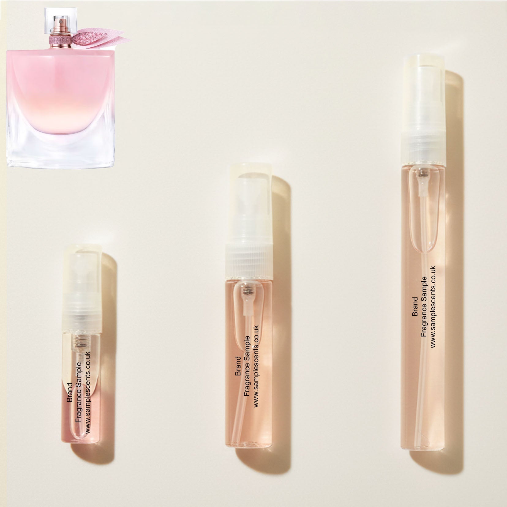 Perfume sample atomisers shown for size reference, hand-decanted from Lancome La Vie Est Belle Vanille Nude bottle.