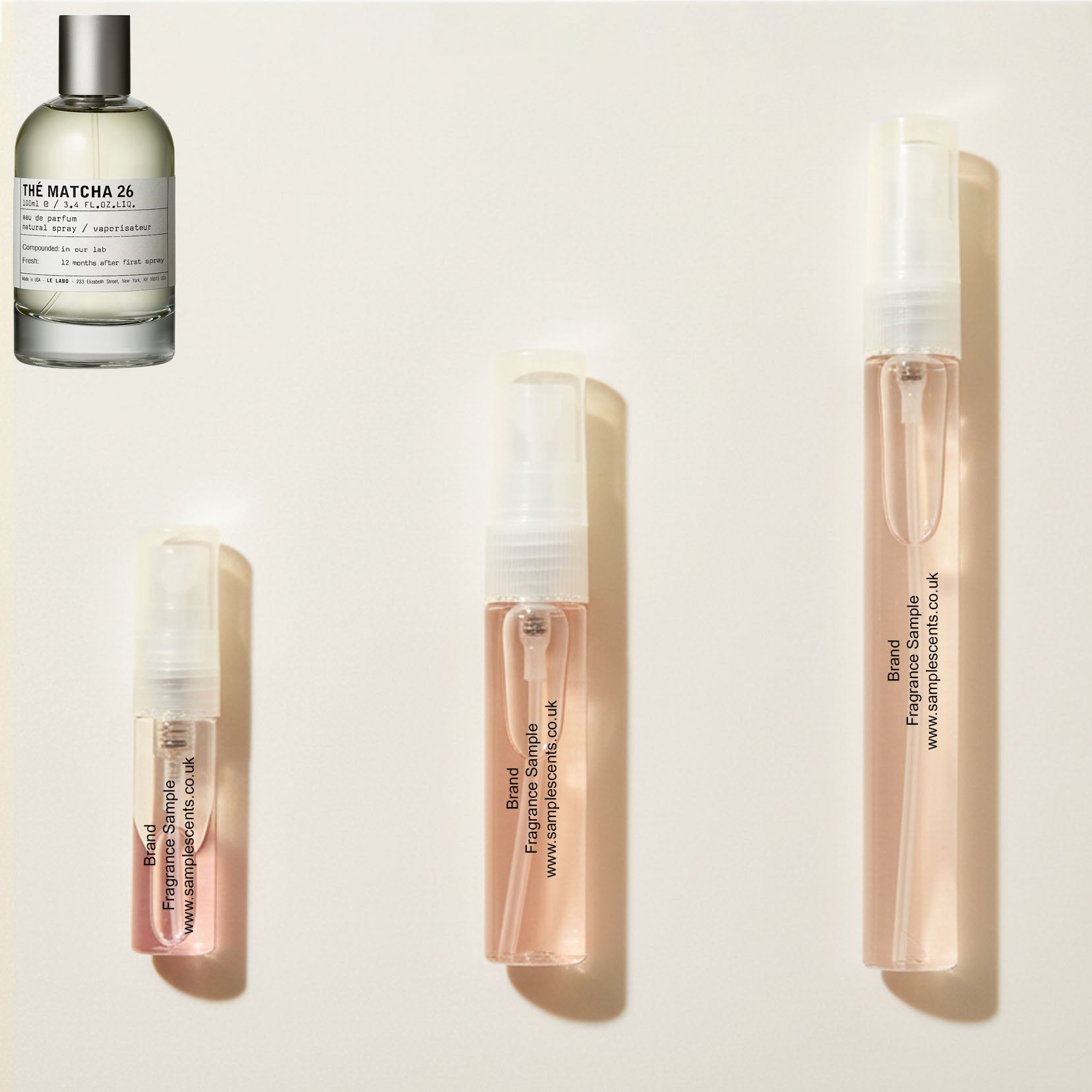 Perfume sample atomisers shown for size reference, hand-decanted from Le Labo The Match 26 bottle.
