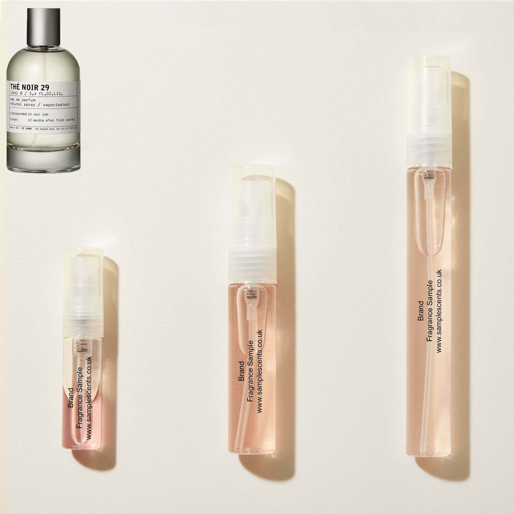 Perfume sample atomisers shown for size reference, hand-decanted from Le Labo The Noir 29 bottle.