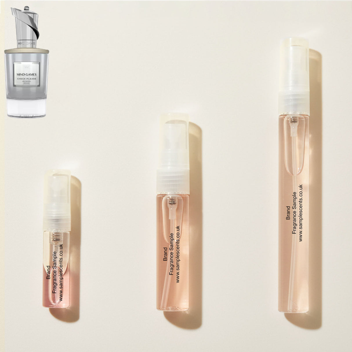 Perfume sample atomisers shown for size reference, hand-decanted from Mind Games Check Please bottle.