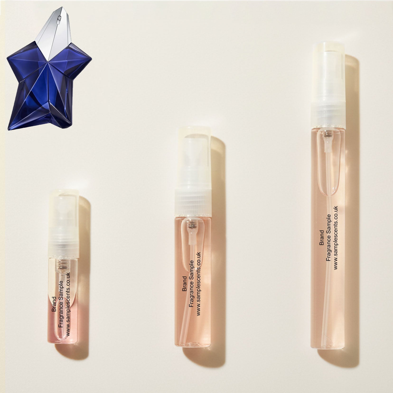 Perfume sample atomisers shown for size reference, hand-decanted from Mugler Angel Elixir bottle.