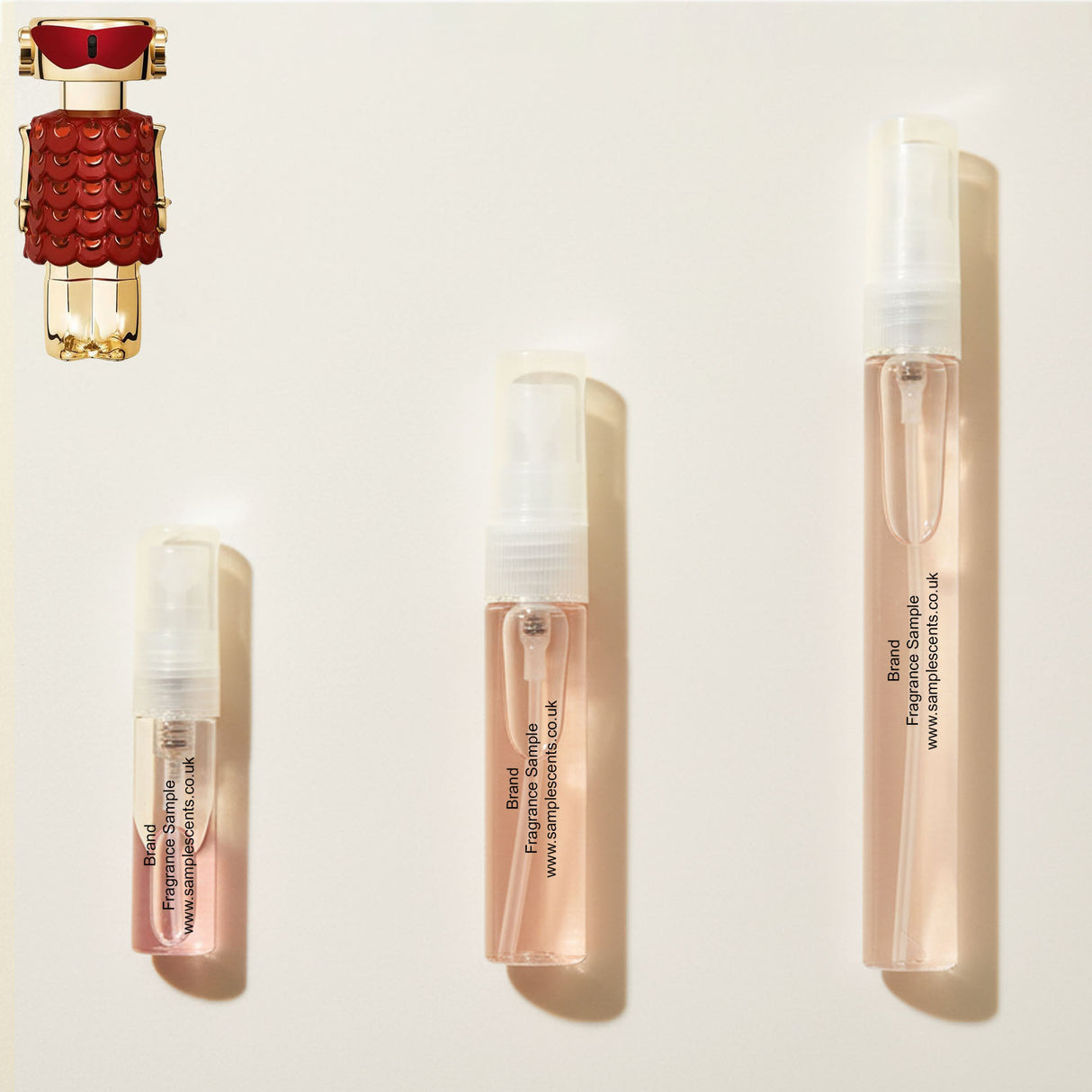 Perfume sample atomisers shown for size reference, hand-decanted from Paco Rabanne Fame In Love bottle.