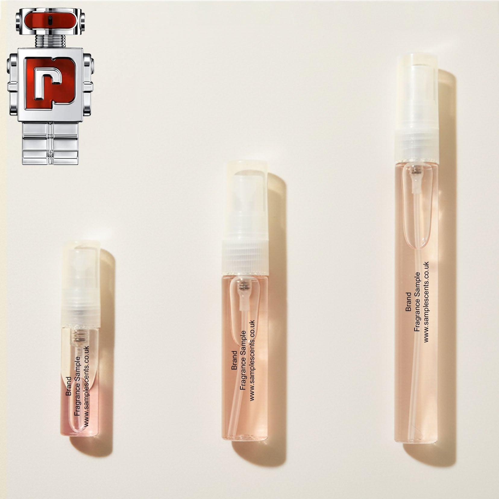 Perfume sample atomisers shown for size reference, hand-decanted from Paco Rabanne Phantom In Red bottle.