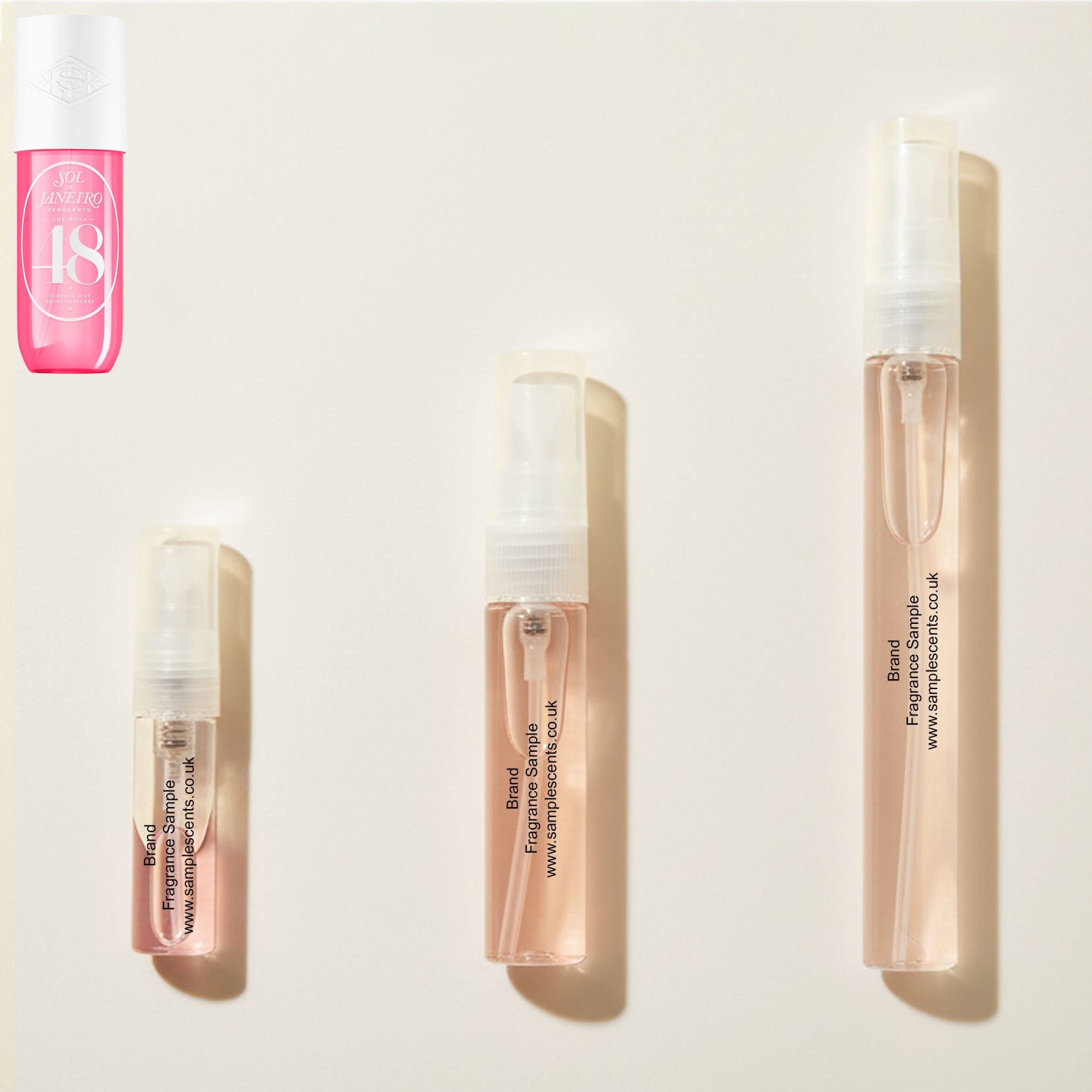 Perfume sample atomisers shown for size reference, hand-decanted from Sol De Janeiro Cheirosa 48 Bikini Season bottle.