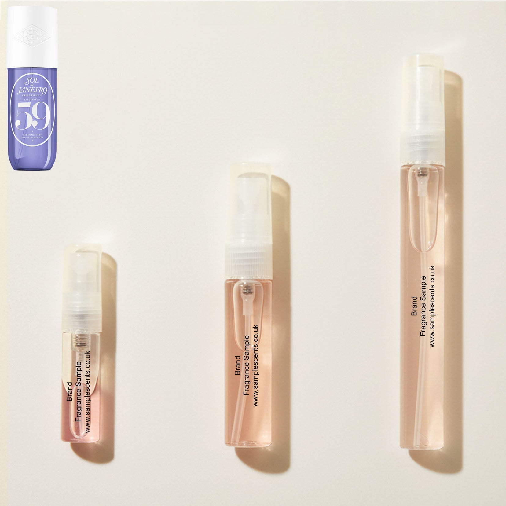 Perfume sample atomisers shown for size reference, hand-decanted from Sol De Janeiro Cheirosa 59 Delicia Drench bottle.