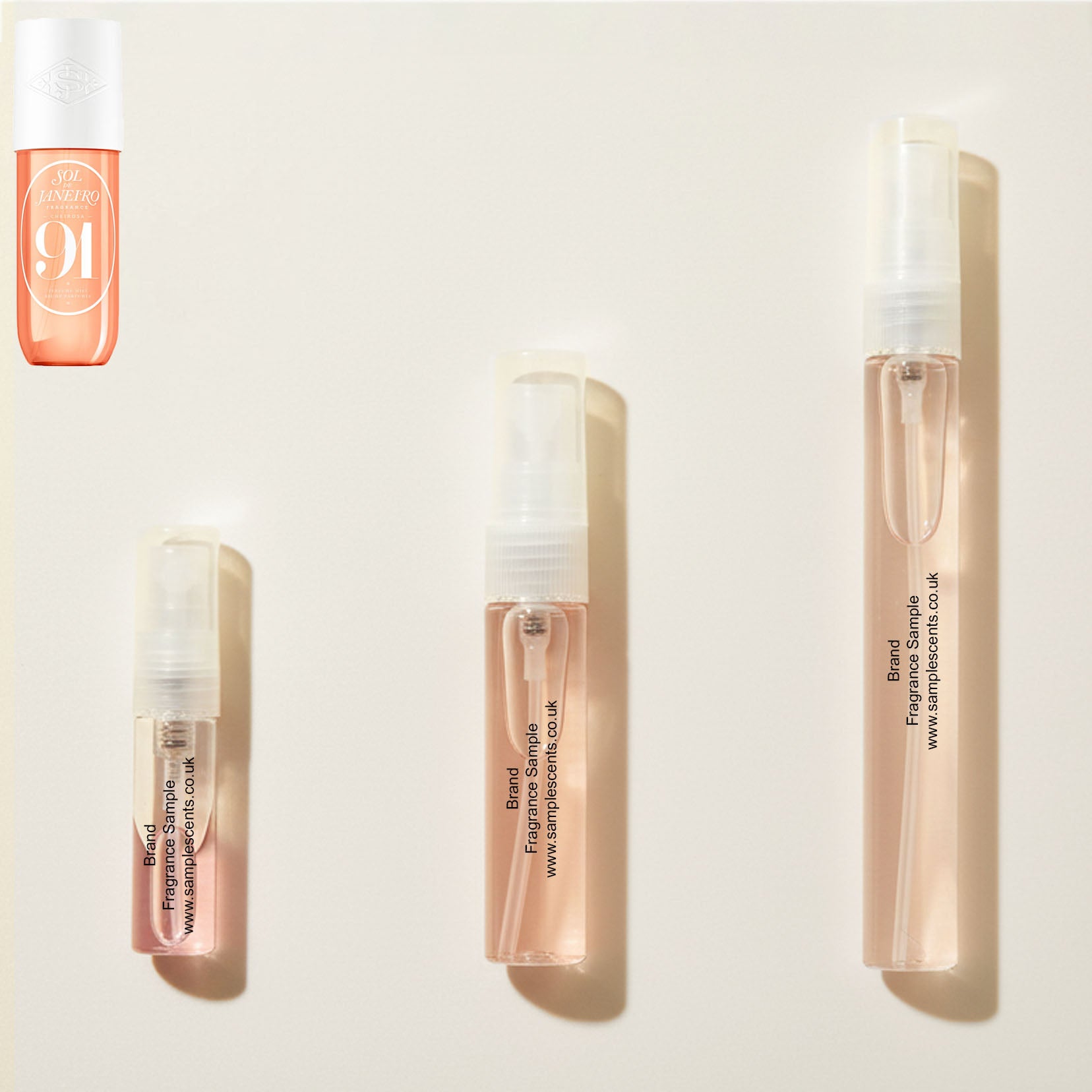 Perfume sample atomisers shown for size reference, hand-decanted from Sol De Janeiro Cheirosa 91 bottle.