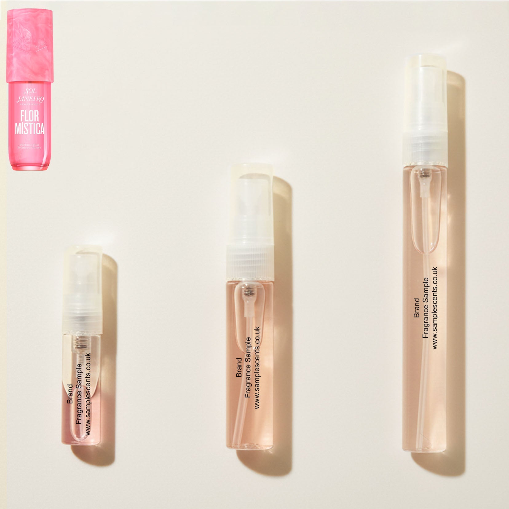 Perfume sample atomisers shown for size reference, hand-decanted from Sol De Janeiro Flor Mistica bottle.