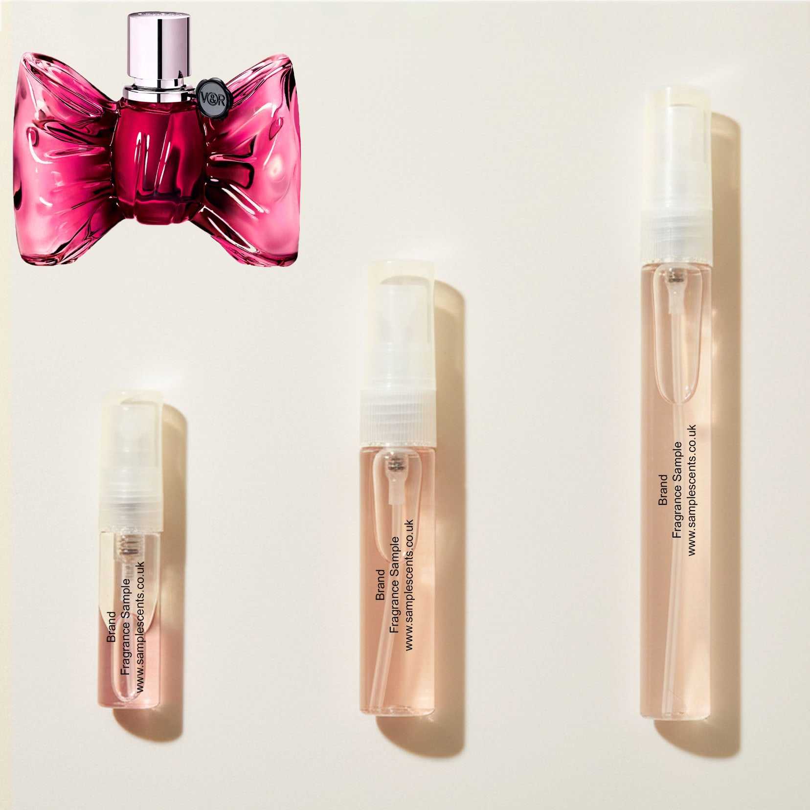 Perfume sample atomisers shown for size reference, hand-decanted from Viktor & Rolf Bonbon bottle.